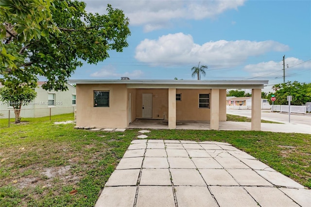 4423 Lake Ave, West Palm Beach, FL 33405 - back of house featuring stucco siding