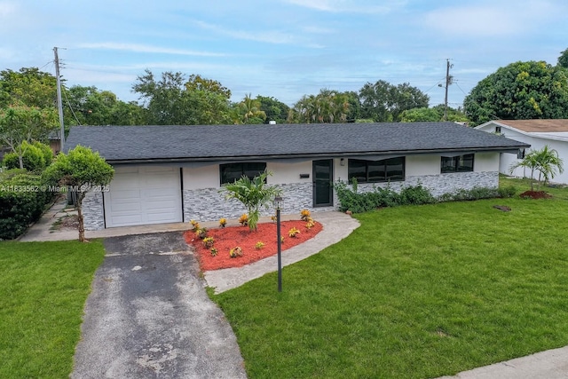 4879 NW 2nd Ct, Plantation, FL 33317 - view of front facade featuring stone siding, a garage, asphalt driveway, a front yard, and stucco siding