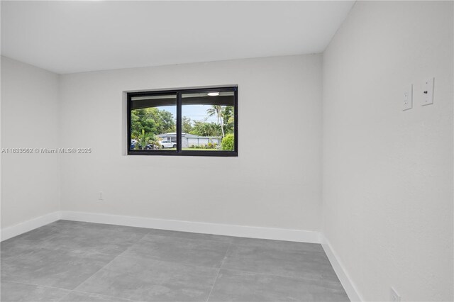 4879 NW 2nd Ct, Plantation, FL 33317 - empty room featuring baseboards and concrete flooring