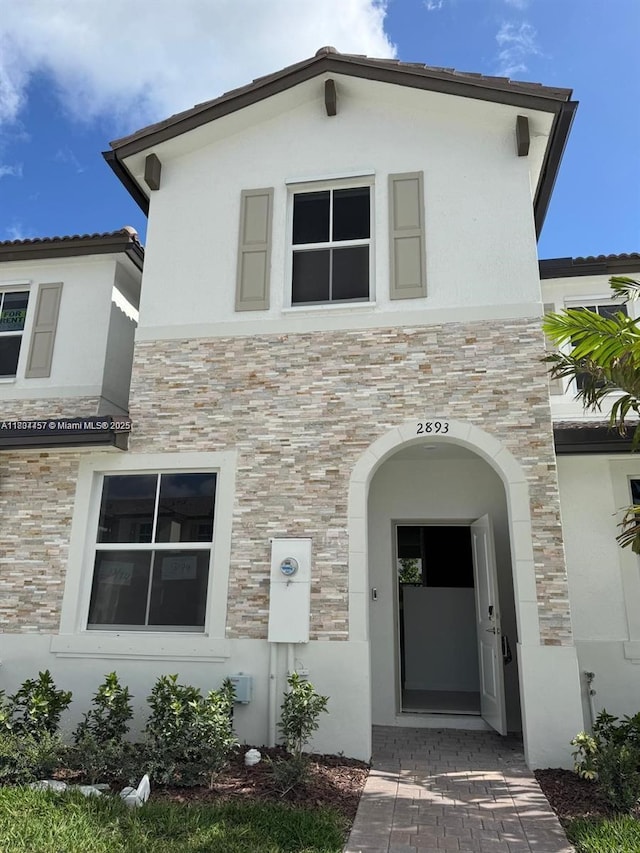 2893 SE 25th Rd Unit 2893, Homestead, FL 33035 - view of front of property featuring stone siding and stucco siding