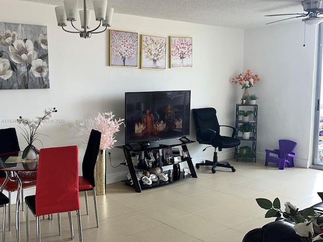 10090 NW 80th Ct Unit 1401, Hialeah Gardens, FL 33016 - dining area featuring a chandelier, a textured ceiling, a ceiling fan, and tile patterned flooring