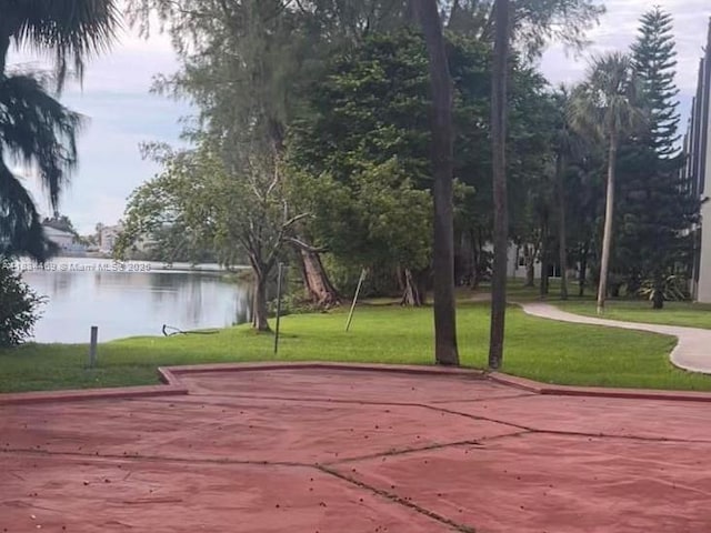 10090 NW 80th Ct Unit 1401, Hialeah Gardens, FL 33016 - view of community featuring a water view and a lawn