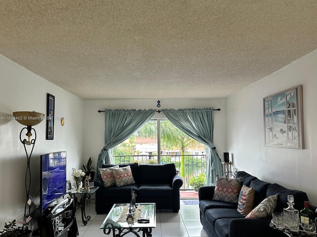 2775 W 52nd St Unit 305, Hialeah, FL 33016 - living area featuring a textured ceiling and light tile patterned floors