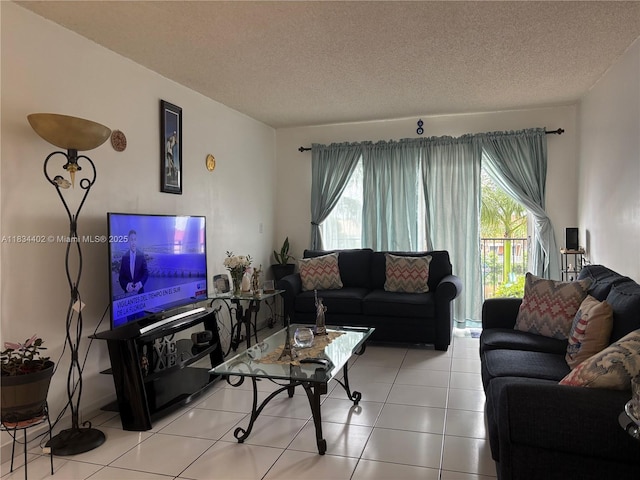 2775 W 52nd St Unit 305, Hialeah, FL 33016 - living area featuring a textured ceiling and tile patterned floors