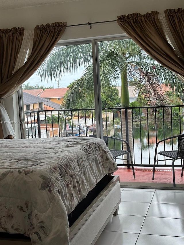 2775 W 52nd St Unit 305, Hialeah, FL 33016 - bedroom with tile patterned flooring, a water view, and multiple windows