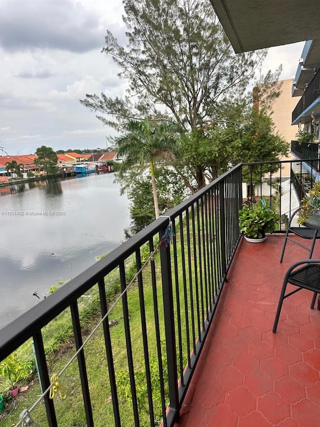 2775 W 52nd St Unit 305, Hialeah, FL 33016 - balcony with a water view