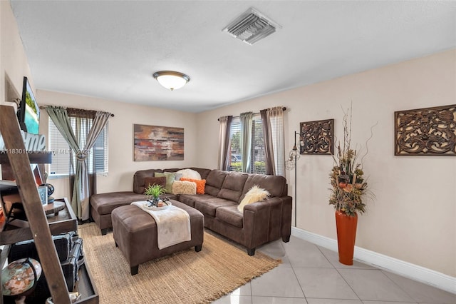 2175 NW 50th St, Miami, FL 33142 - living area featuring light tile patterned flooring and baseboards