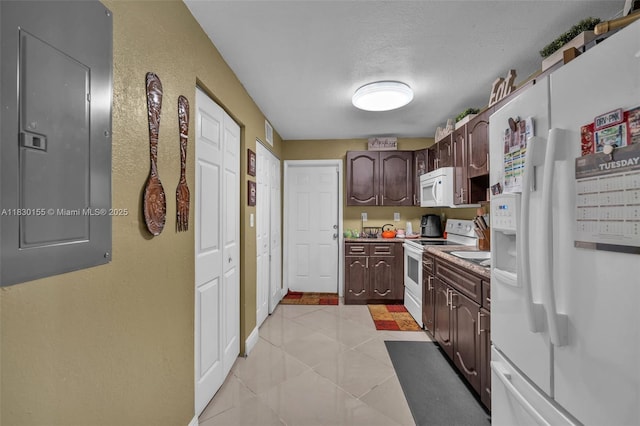 2175 NW 50th St, Miami, FL 33142 - kitchen featuring white appliances, electric panel, dark brown cabinetry, a textured ceiling, and light tile patterned floors