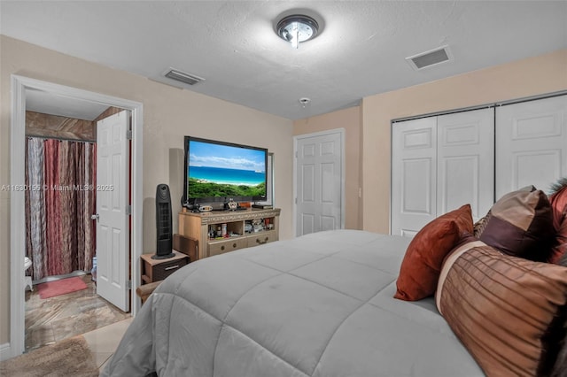 2175 NW 50th St, Miami, FL 33142 - bedroom featuring a closet and a textured ceiling