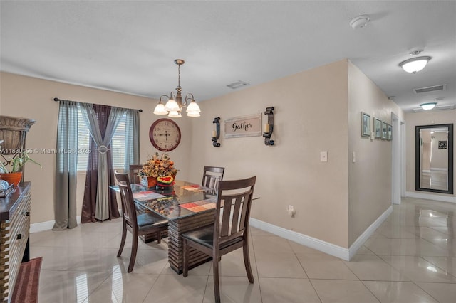 2175 NW 50th St, Miami, FL 33142 - dining area with a chandelier and light tile patterned flooring