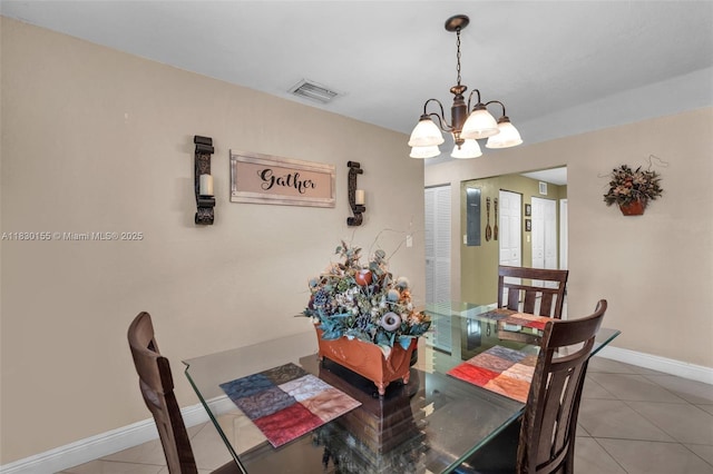 2175 NW 50th St, Miami, FL 33142 - dining space with a chandelier and light tile patterned flooring