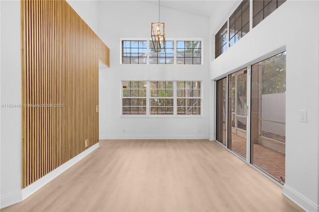 1525 Seabay Rd, Weston, FL 33326 - unfurnished sunroom featuring a chandelier and lofted ceiling