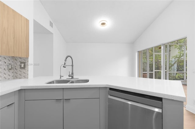 1525 Seabay Rd, Weston, FL 33326 - kitchen featuring dishwasher, gray cabinets, modern cabinets, lofted ceiling, and a peninsula
