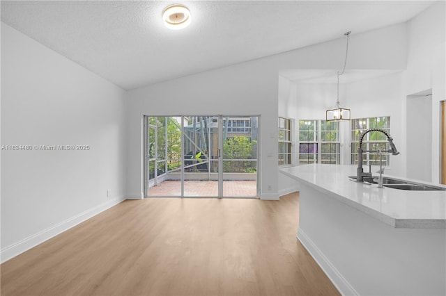 1525 Seabay Rd, Weston, FL 33326 - unfurnished living room with light wood-style flooring and high vaulted ceiling