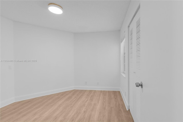 1525 Seabay Rd, Weston, FL 33326 - unfurnished bedroom with light wood-style flooring and a closet