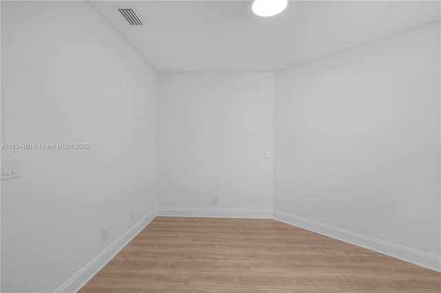 1525 Seabay Rd, Weston, FL 33326 - spare room featuring light wood finished floors and baseboards