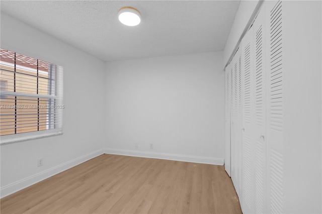 1525 Seabay Rd, Weston, FL 33326 - unfurnished bedroom with light wood-style flooring and a closet