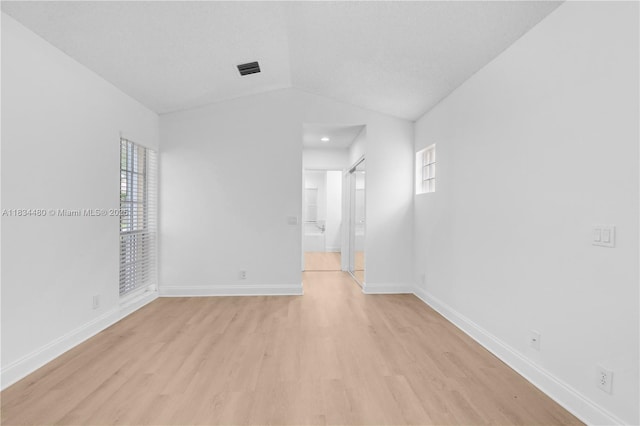 1525 Seabay Rd, Weston, FL 33326 - empty room featuring light wood-style flooring, lofted ceiling, and recessed lighting