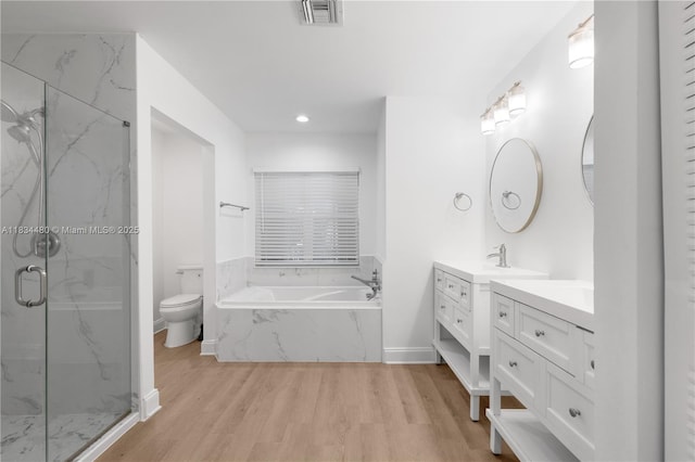1525 Seabay Rd, Weston, FL 33326 - bathroom with vanity, a bath, a marble finish shower, wood finished floors, and recessed lighting