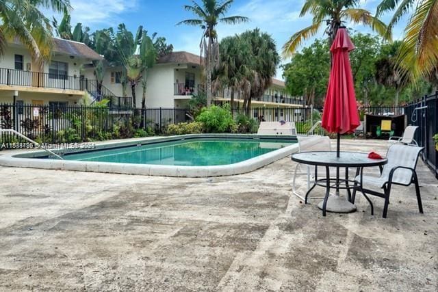 4160 NW 21st St Unit 115E, Lauderhill, FL 33313 - community pool featuring a patio