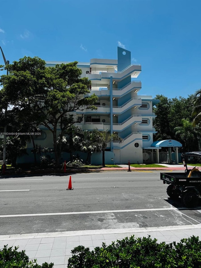 9156 Collins Ave Unit 310, Surfside, FL 33154 - view of building exterior featuring uncovered parking