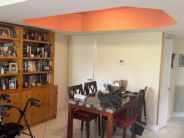 9156 Collins Ave Unit 310, Surfside, FL 33154 - dining space with light tile patterned flooring and baseboards