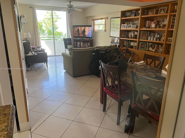 9156 Collins Ave Unit 310, Surfside, FL 33154 - dining room with light tile patterned flooring and ceiling fan