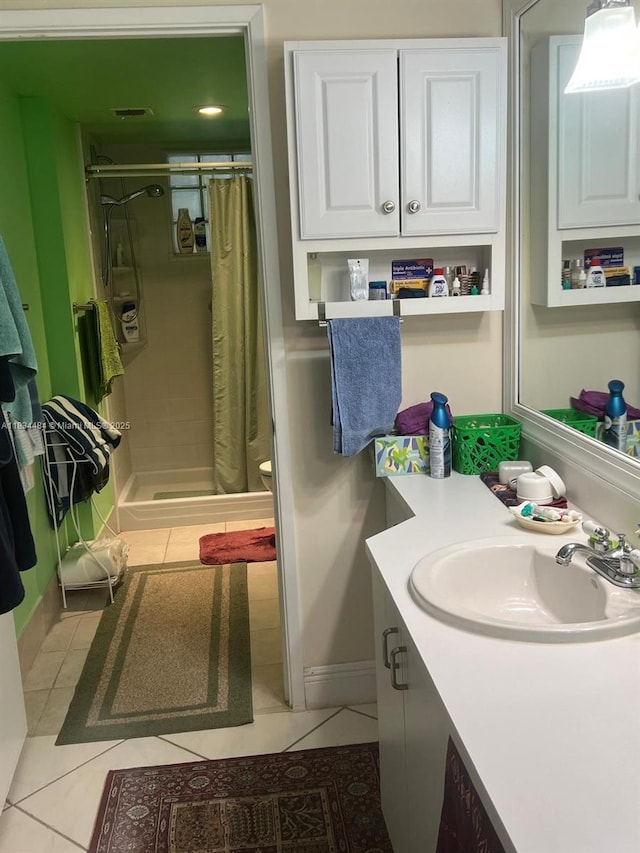 9156 Collins Ave Unit 310, Surfside, FL 33154 - bathroom featuring tile patterned flooring, a stall shower, and vanity