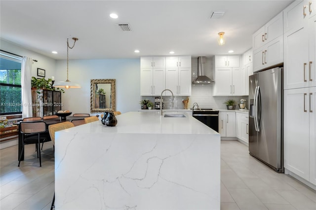 9932 NW 10th St, Miami, FL 33172 - kitchen with stainless steel fridge with ice dispenser, wall chimney exhaust hood, range with electric cooktop, tasteful backsplash, and white cabinetry