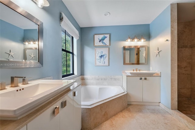 9932 NW 10th St, Miami, FL 33172 - bathroom featuring a garden tub, two vanities, tiled shower, and tile patterned flooring