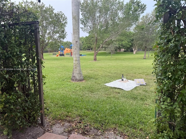 9932 NW 10th St, Miami, FL 33172 - view of grassy yard featuring a playground