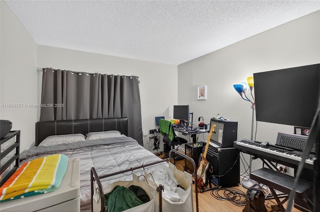 7745 SW 86th St Unit D-222, Miami, FL 33143 - bedroom with wood finished floors and a textured ceiling