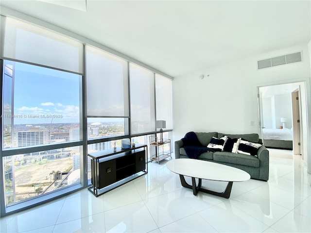 851 NE 1st Ave Unit 2802, Miami, FL 33132 - living area featuring a wall of windows and light tile patterned floors