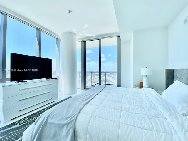 851 NE 1st Ave Unit 2802, Miami, FL 33132 - bedroom with expansive windows and access to exterior