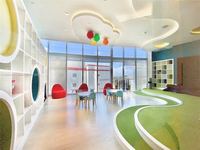 851 NE 1st Ave Unit 2802, Miami, FL 33132 - playroom featuring a wall of windows and wood finished floors