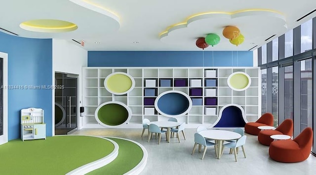 851 NE 1st Ave Unit 2802, Miami, FL 33132 - playroom featuring built in shelves and wood finished floors