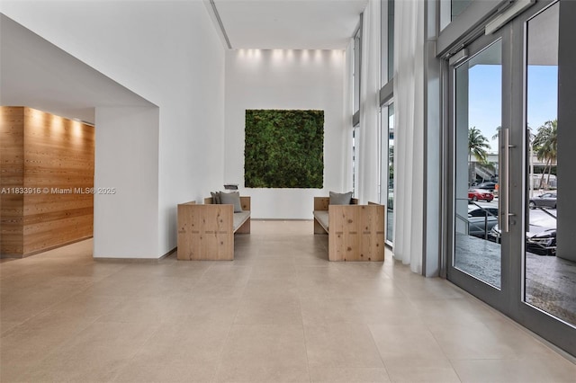 1040 Biscayne Blvd Unit 2108, Miami, FL 33132 - hallway with a towering ceiling and french doors
