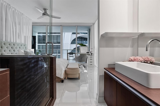 1040 Biscayne Blvd Unit 2108, Miami, FL 33132 - bathroom featuring ensuite bathroom, ceiling fan, vanity, tile patterned floors, and an enclosed shower