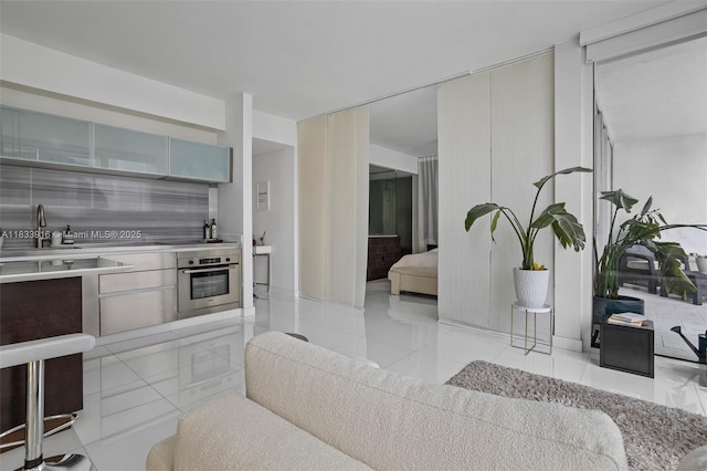 1040 Biscayne Blvd Unit 2108, Miami, FL 33132 - kitchen with stainless steel oven, tasteful backsplash, light countertops, and modern cabinets