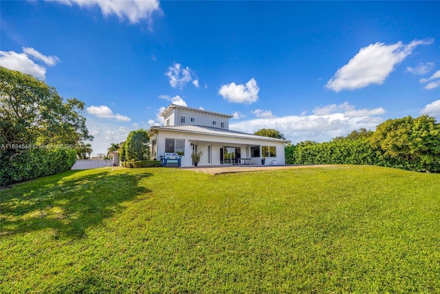 16701 SW 49th St, Southwest Ranches, FL 33331 - rear view of property featuring a patio, a lawn, and stucco siding