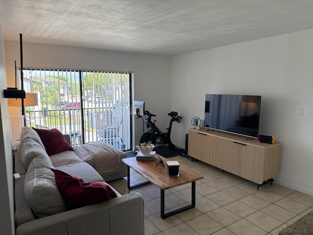7180 NW 179th St Unit 202, Hialeah, FL 33015 - living room featuring light tile patterned flooring and a textured ceiling