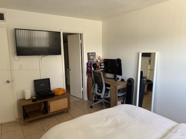 7180 NW 179th St Unit 202, Hialeah, FL 33015 - tiled bedroom with a desk
