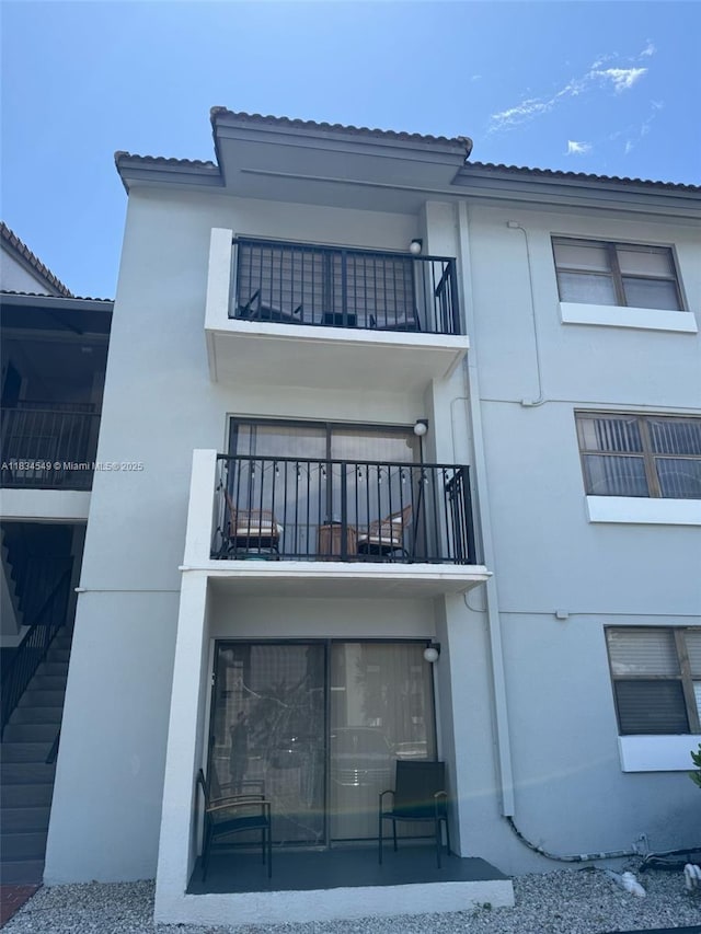 7180 NW 179th St Unit 202, Hialeah, FL 33015 - view of building exterior featuring stairs