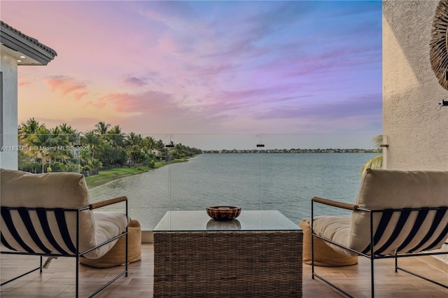 18269 SW 54th St, Miramar, FL 33029 - balcony at dusk featuring a water view and an outdoor living space