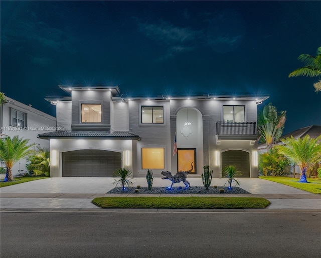 18269 SW 54th St, Miramar, FL 33029 - view of front of house with a balcony, an attached garage, concrete driveway, and stucco siding