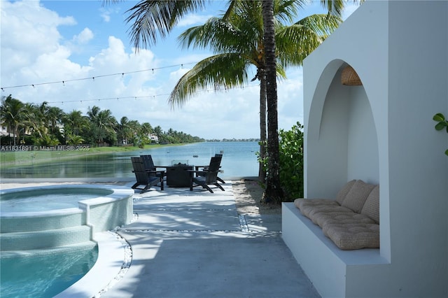 18269 SW 54th St, Miramar, FL 33029 - view of patio with an outdoor hot tub and a water view