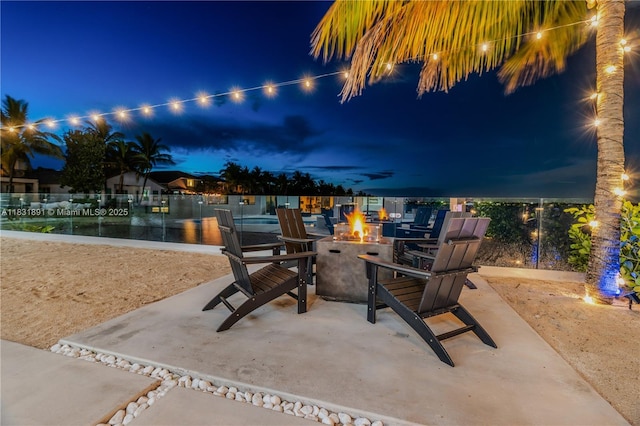 18269 SW 54th St, Miramar, FL 33029 - patio at night featuring a fire pit and a patio area