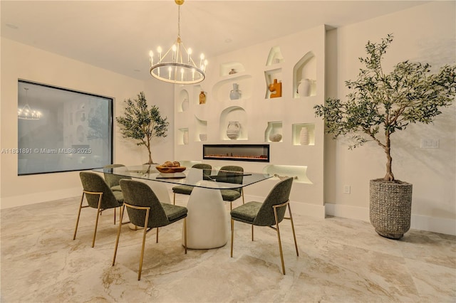 18269 SW 54th St, Miramar, FL 33029 - dining area featuring marble finish floors, a chandelier, and a glass covered fireplace