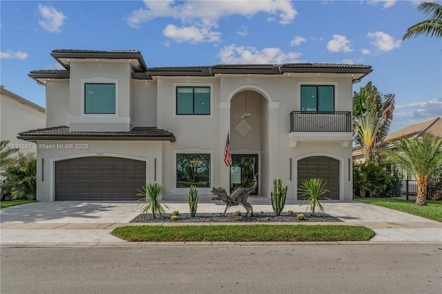 18269 SW 54th St, Miramar, FL 33029 - mediterranean / spanish-style house featuring an attached garage, a tiled roof, a balcony, driveway, and stucco siding