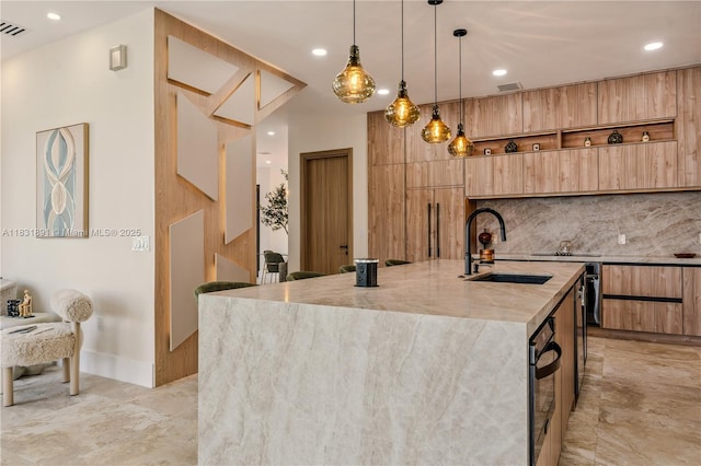 18269 SW 54th St, Miramar, FL 33029 - kitchen featuring modern cabinets, light stone countertops, a kitchen island with sink, backsplash, and pendant lighting